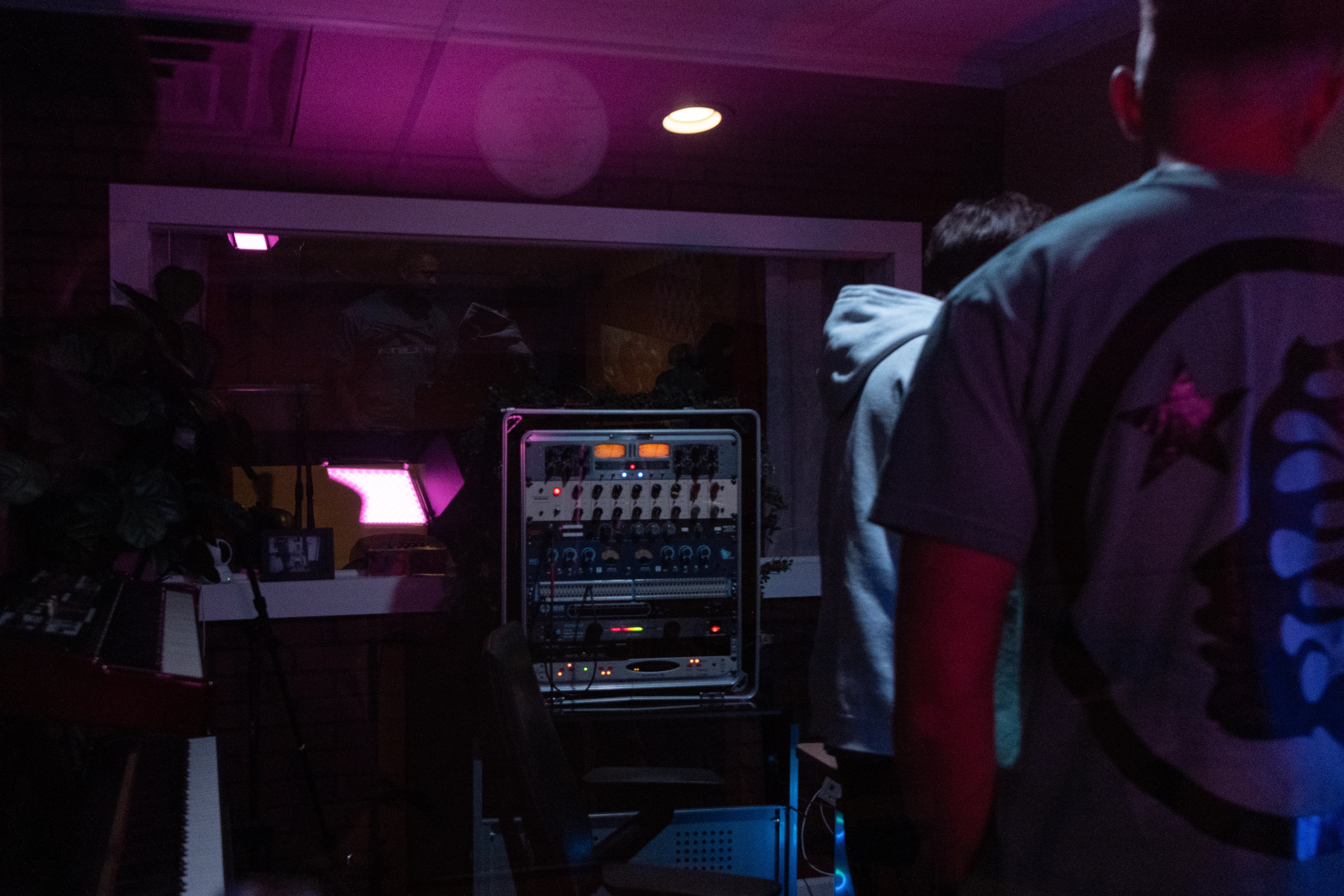 The main studio workstation with dual monitors and speakers.
